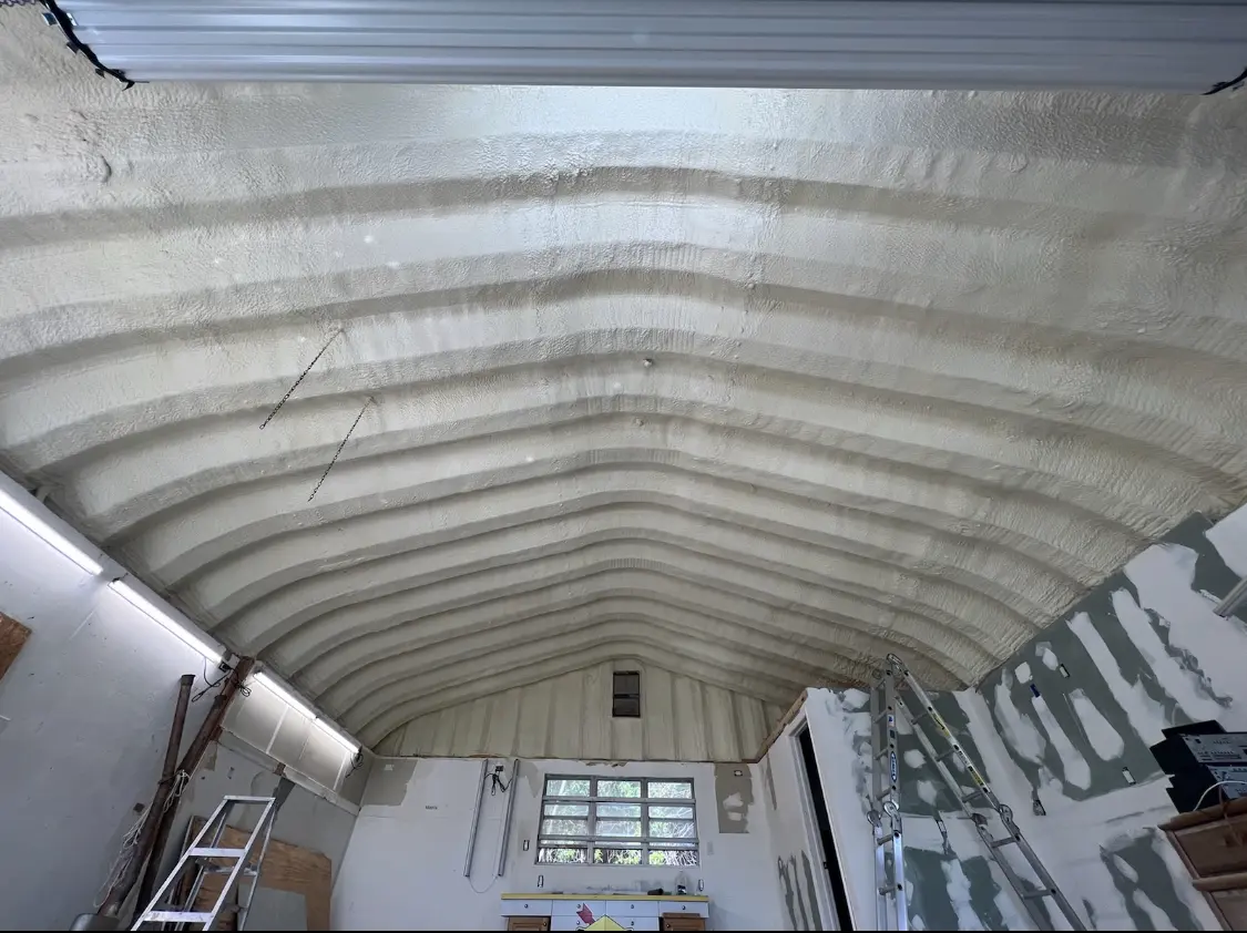 Spray polyurethane foam applied to the underside of a metal roof deck in Butler